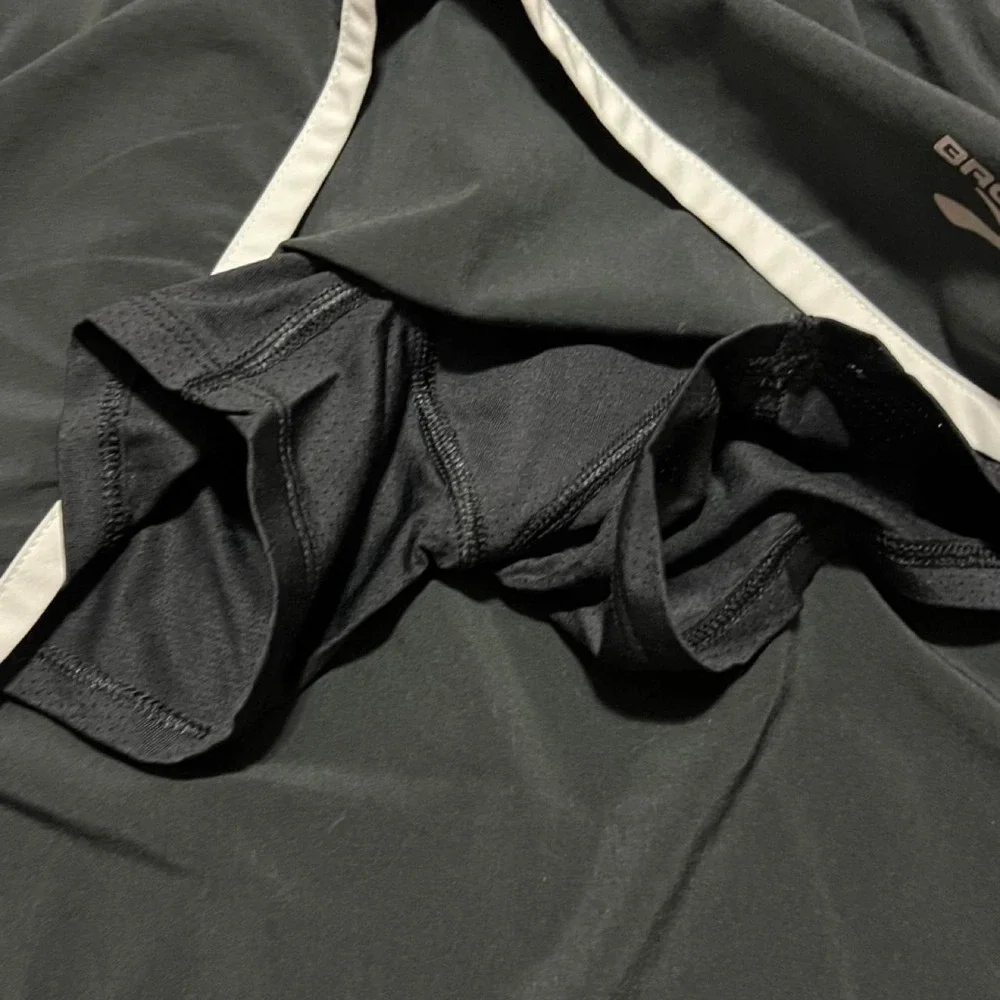 Brooks black running shorts with white side stripes 314.5